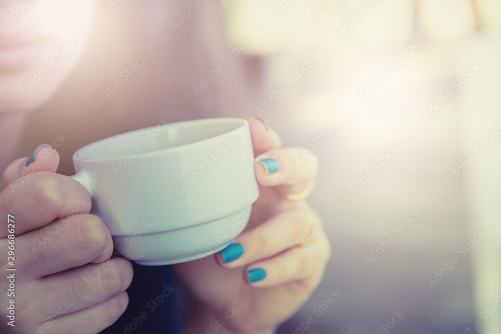 Woman drinking coffee in hand Woman drinking coffee in hand