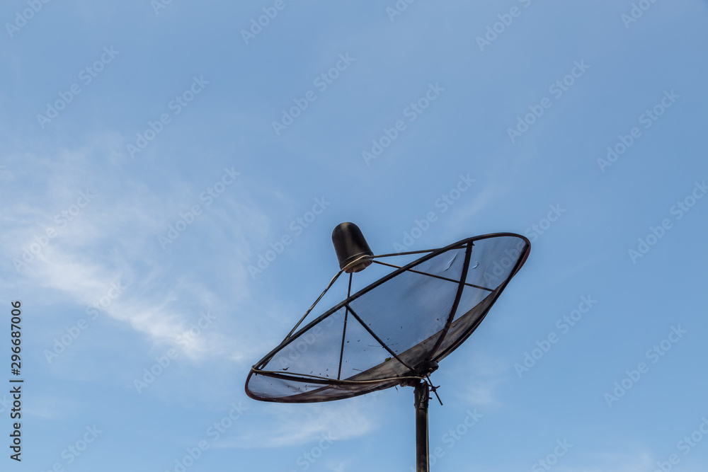 Old satellite dish on blue sky Old satellite dish on blue sky