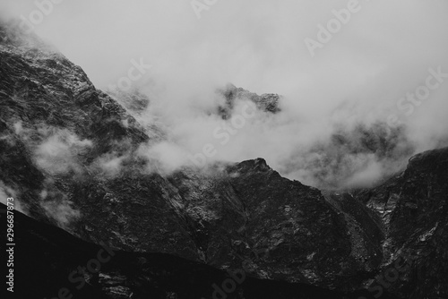 heavy clouds on the sharp Tatra mountain, black and white with noise