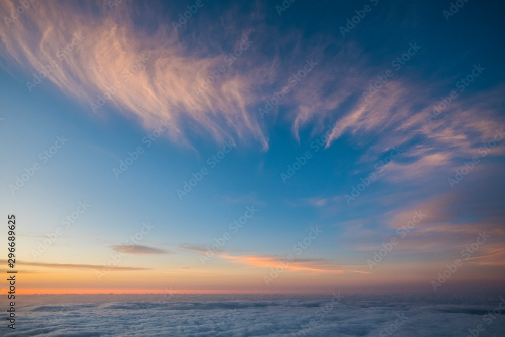 Fototapeta premium Sky and clouds beautiful rare landscape - blue colors and horizon - beauty of outdoor nature - fly and travel concept - sunset or sunrise time and. natural coloured background at the mountain