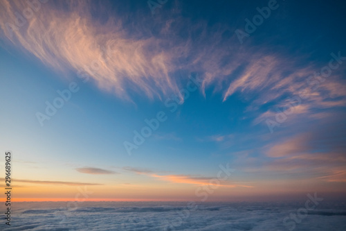 Sky and clouds beautiful rare landscape - blue colors and horizon - beauty of outdoor nature - fly and travel concept - sunset or sunrise time and.  natural coloured background at the mountain photo