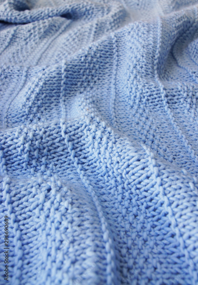 background textile blue knitted plaid of  woolen yarn