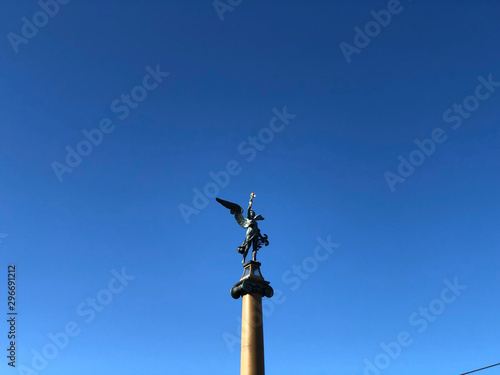 Bridge statue under clear blue sky in Prague