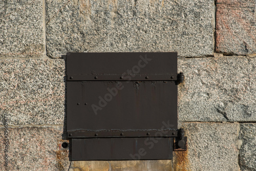 Metall hatch on an old fortress at Vaxholm in the Stockholm archipelago photo