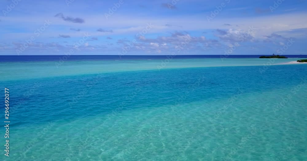 Dreamlike view of the blue tropical sky with far away islands Dreamlike view of the blue tropical sky with far away islands