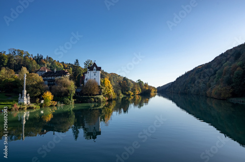 old castel at the river in autumn blue sky