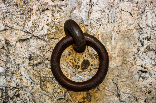 Close up of an old rusty door knocker.