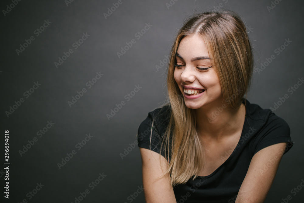 Fashion portrait of a sexy blonde woman with a make up wearing black clothes Fashion portrait of a sexy blonde woman with a make up wearing black clothes