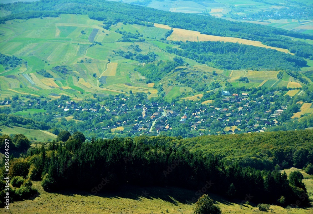 landscape with a village between the hills of Transylvania