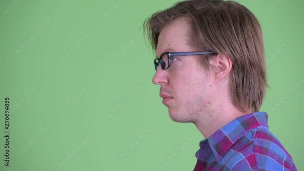 Closeup profile view of young handsome hipster man with eyeglasses Closeup profile view of young handsome hipster man with eyeglasses
