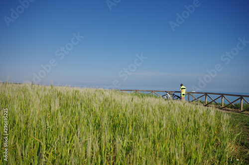 Cyclist is resting in Punta Aderci, Vasto, Abruzzo, Italy