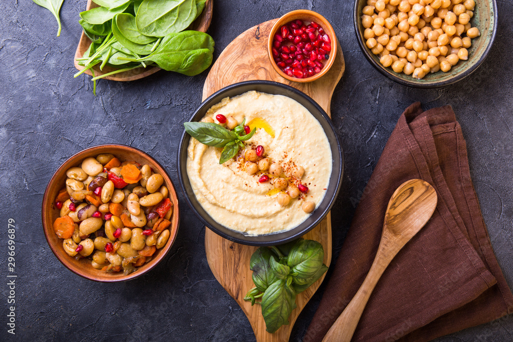 Mediterranean mezze board with hummus, beans, spinach . top view Mediterranean mezze board with hummus, beans, spinach . top view