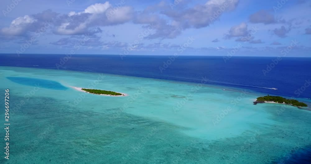 Paradise islands surrounded by beautiful turquoise seascape on The Maldives, slow aerial view Paradise islands surrounded by beautiful turquoise seascape on The Maldives, slow aerial view