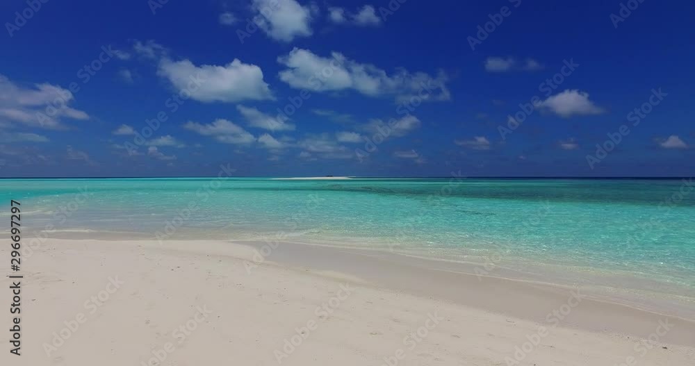 Beautiful panorama view of endless ocean under cloudy sky from shallow turquoise waters of sandy shore in The Azores Beautiful panorama view of endless ocean under cloudy sky from shallow turquoise waters of sandy shore in The Azores