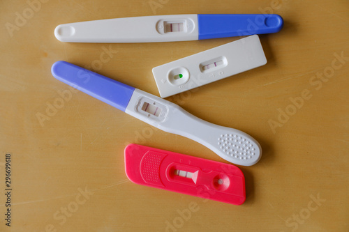 Many positive pregnancy tests on  the Table  photo