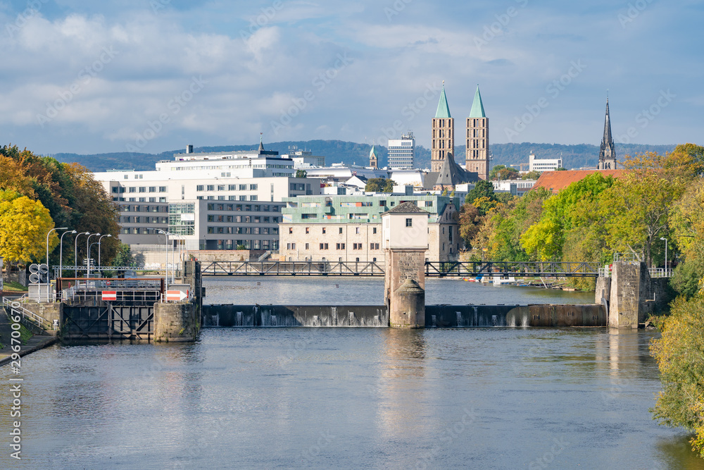 View over the river Fulda with its lock to the city center of Kassel, Germany, on a sunny autumn day