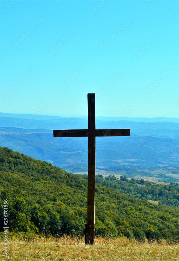 a cross on a hill