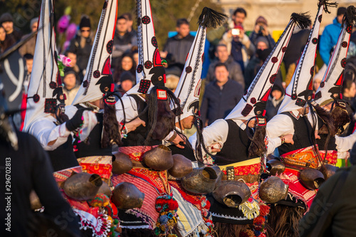 Mummers perform rituals to scare evil spirits at Surva festival at Pernik in Bulgaria. The people with the masks are called Kuker (kukeri). Dancers with big bells.