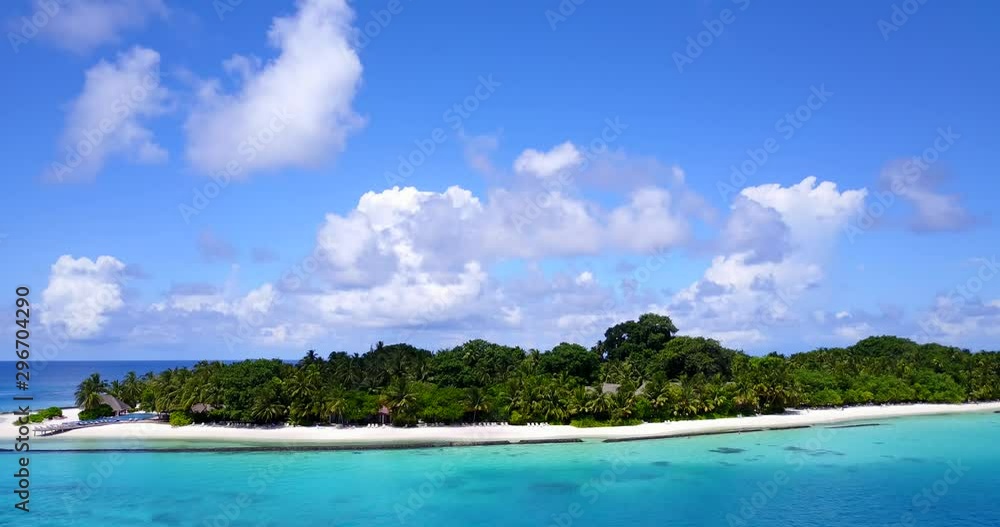 Tropical island with palms background. aerial drone tilting up shot with copy space Tropical island with palms background. aerial drone tilting up shot with copy space