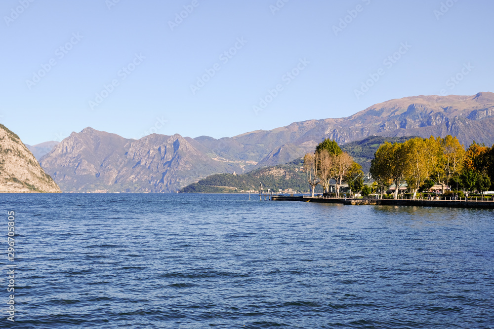 Landscape of Iseo Lake. Alpine lake during a sunny day with a blue sky.