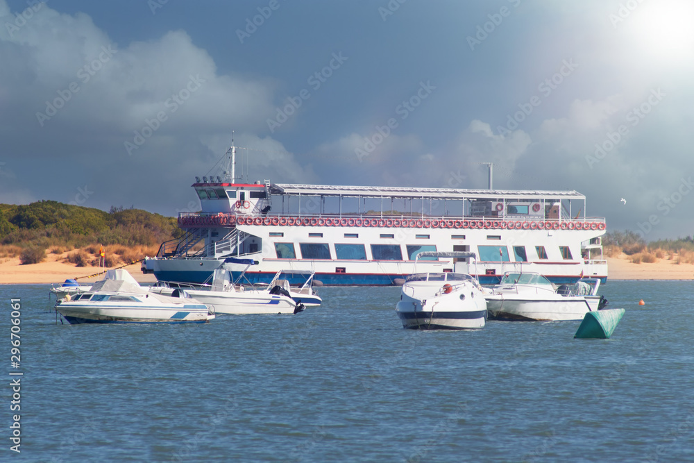 Passenger ferry on the river among the boats. Passenger ferry on the river among the boats.