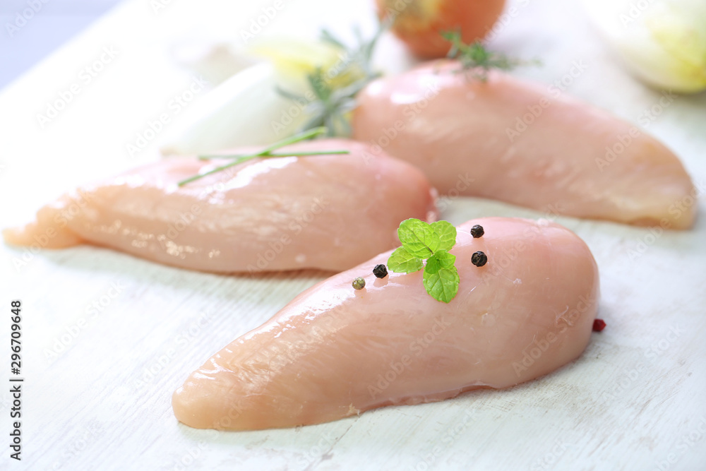 raw chicken breast on wooden background raw chicken breast on wooden background