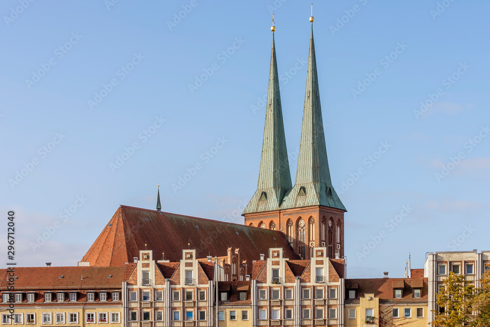 The spiers of St. Nicholas Church illuminated by morning light in the Mitte district of Berlin, Germany