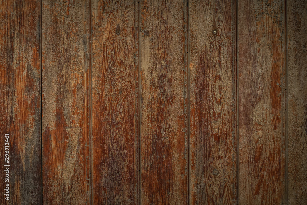 Dark brown wooden boards with a worn surface. Old wooden background texture with vertical pattern. Dark brown wooden boards with a worn surface. Old wooden background texture with vertical pattern.