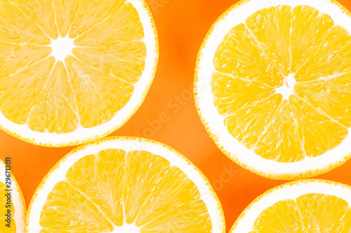 slices of orange isolated on orange background