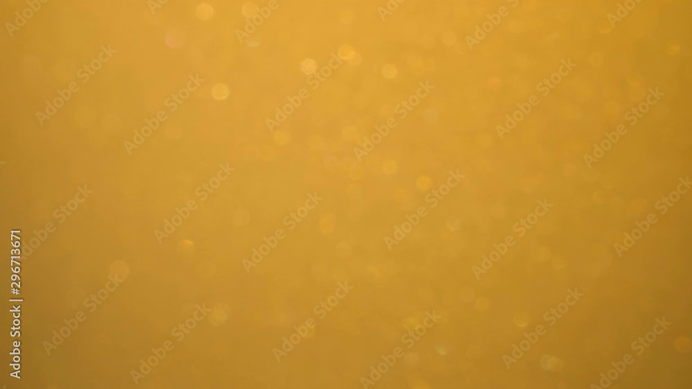 Golden Wave Background. Art Gold Background. Golden Sand , Dust Creating Abstract Cloud Formations. Slow Motion. Gold Texture. Amazing Metamorphosis Sparkle Shiny Particles Defocused Blur Bokeh Golden Wave Background. Art Gold Background. Golden Sand , Dust Creating Abstract Cloud Formations. Slow Motion. Gold Texture. Amazing Metamorphosis Sparkle Shiny Particles Defocused Blur Bokeh
