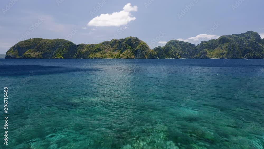 4K Aerial low altitude fly over open ocean towards tropical islands. El Nido, Palawan, Philippines. Barcuit Archipelago 4K Aerial low altitude fly over open ocean towards tropical islands. El Nido, Palawan, Philippines. Barcuit Archipelago