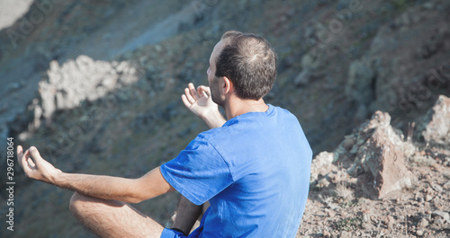 aucasian man meditating in outdoors. © andranik123
