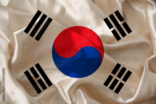 photo of the beautiful colored national flag of the modern state of South Korea on textured fabric, concept of tourism, emigration, economics and politics, closeup