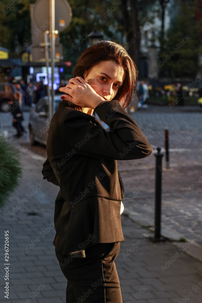 Black haired girl.Business woman in black classic suit.White blouse.Fashion style. Black haired girl.Business woman in black classic suit.White blouse.Fashion style.