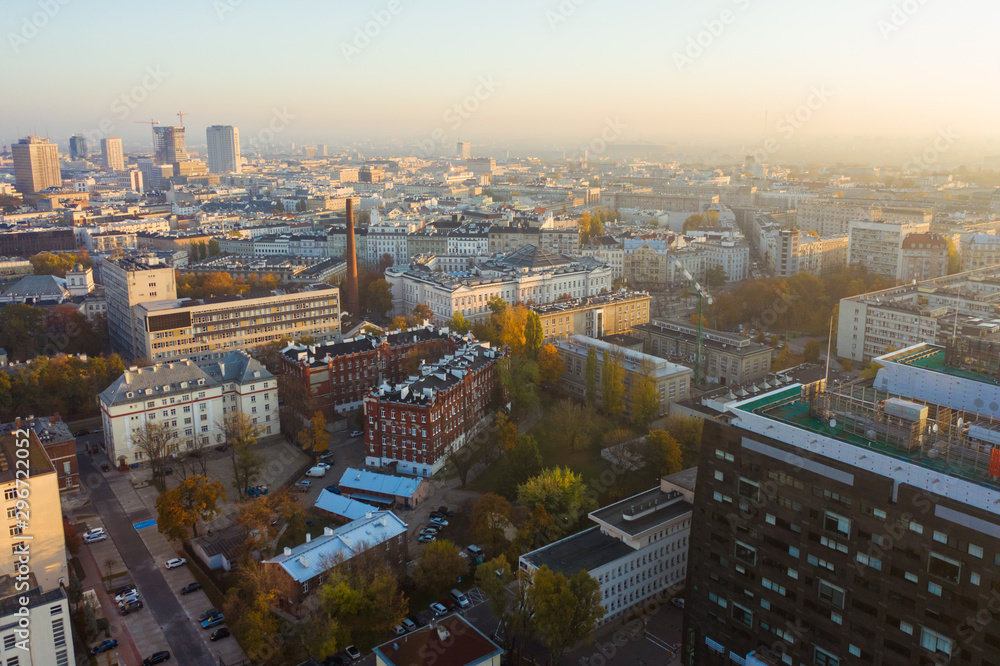 Aerial view of a beautiful cityscape with skyscrapers and buildings at sunrise. Warsaw Poland. 16. October. 2019. Drone flies of a beautiful cityscape with skyscrapers at sunrise. 