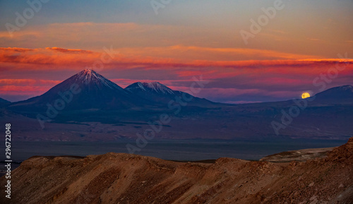 Moon rising over the mountains in Atacama desert photo