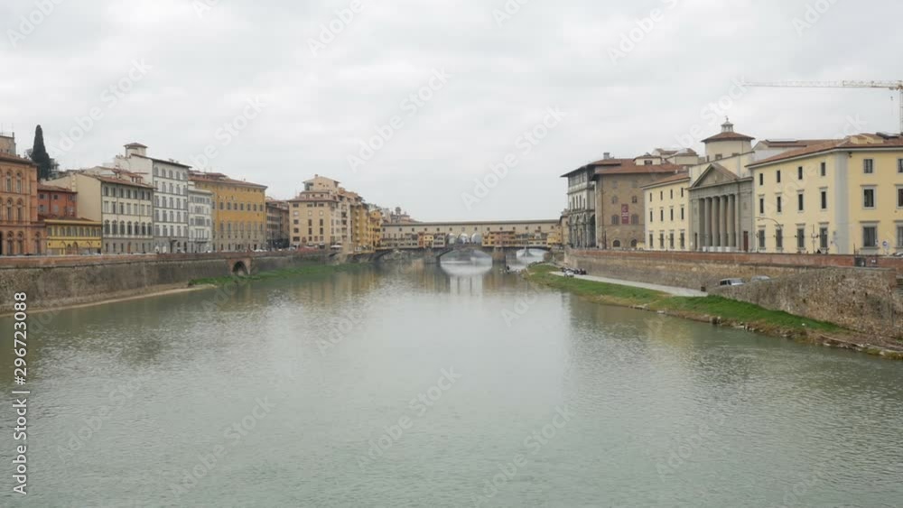 Front View of Ponte Vecchio, green river and cloudy sky - Florence, Italy Front View of Ponte Vecchio, green river and cloudy sky - Florence, Italy