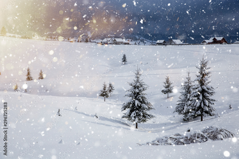 Scenic winter landscape with snowy fir trees and small cottage. Scenic winter landscape with snowy fir trees and small cottage.