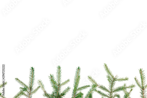 Christmas winter frame of fir-tree branches on white background. New Year background. Flat lay