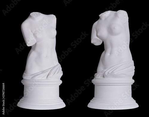 Statue. On a black isolated background. Gypsum  torso of Venus.