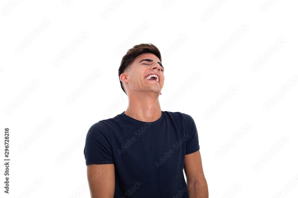 Handsome young man laughing in a photo studio Handsome young man laughing in a photo studio