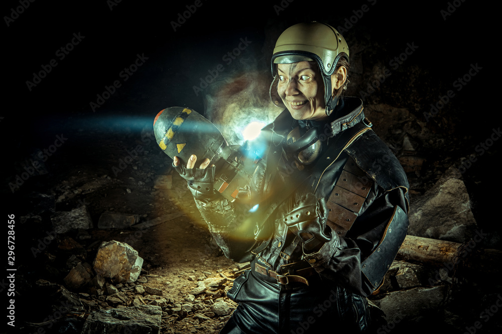 Soldier woman with the bomb on post apocalyptic background. Soldier woman with the bomb on post apocalyptic background.