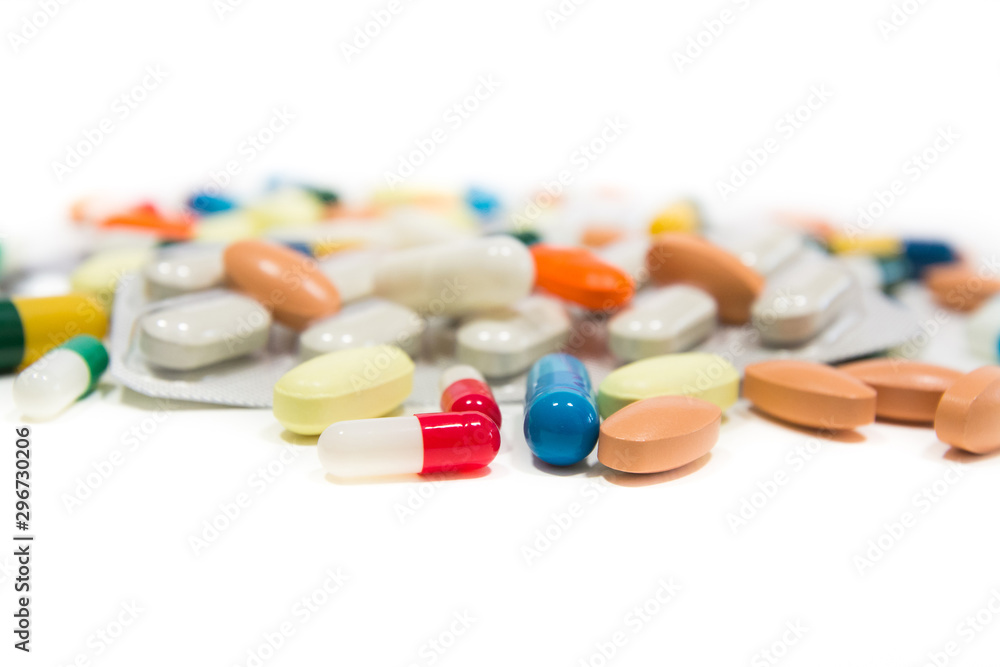 Assorted pharmaceutical medicine pills, tablets and capsules over white background Assorted pharmaceutical medicine pills, tablets and capsules over white background