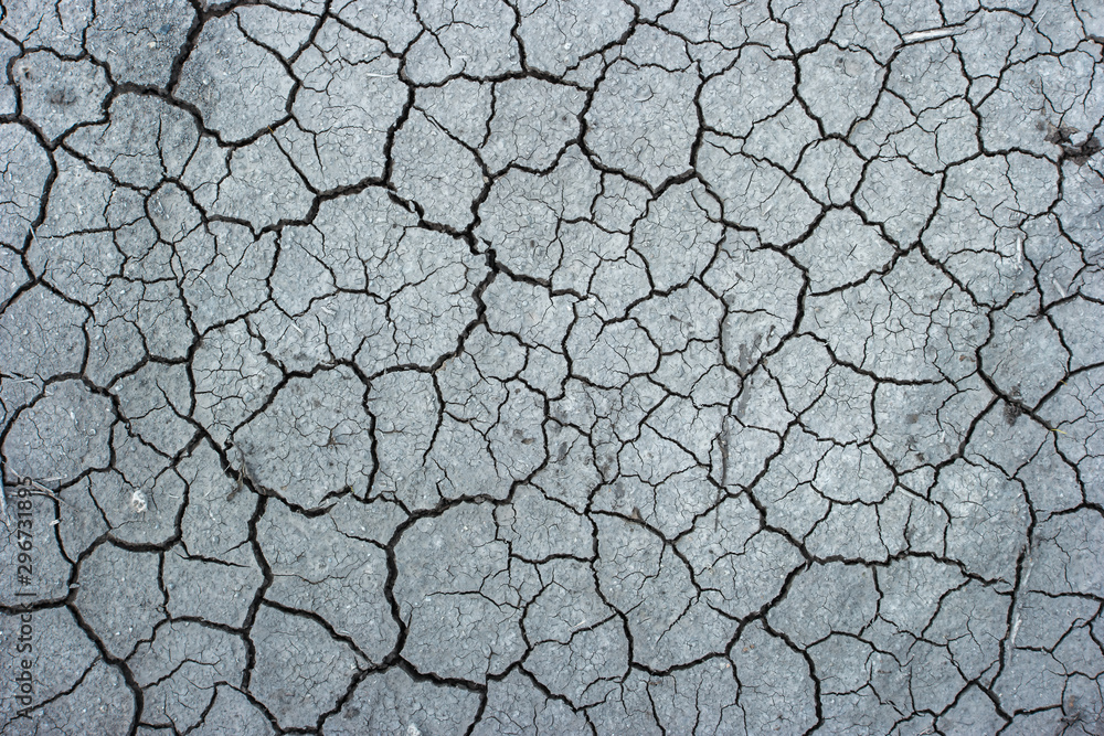 Photo of cracked dry land soil from above - obrazy, fototapety, plakaty 