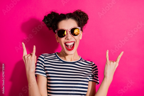 Close-up portrait of her she nice attractive lovely crazy overjoyed cheerful cheery girl showing two horns symbols isolated over bright vivid shine vibrant pink fuchsia color background