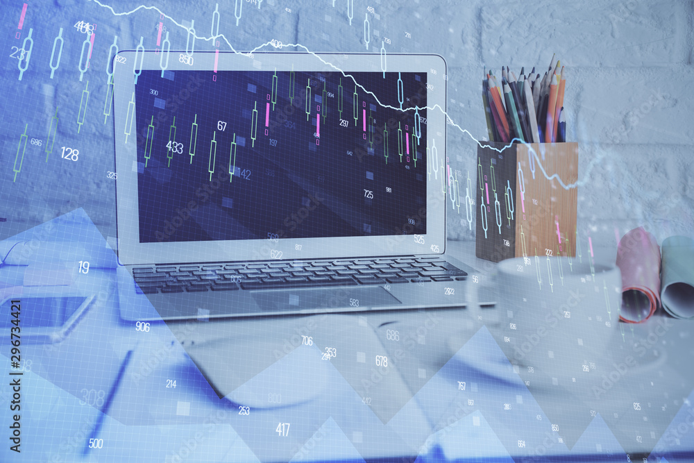 Financial chart drawing and table with computer on background. Multi exposure. Concept of international markets. Financial chart drawing and table with computer on background. Multi exposure. Concept of international markets.