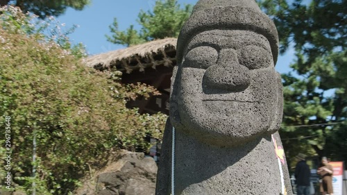 Harbang is a symbol and mascot of Jeju Island, Korea. There is a ticket office behind.