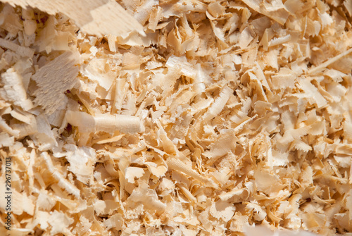 Wood sawdust background closeup. Sawdust floor texture. Top view. Sawdust texture, close-up background of brown sawdust