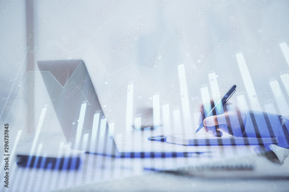 Multi exposure of forex chart with man working on computer on background. Concept of market analysis. Multi exposure of forex chart with man working on computer on background. Concept of market analysis.