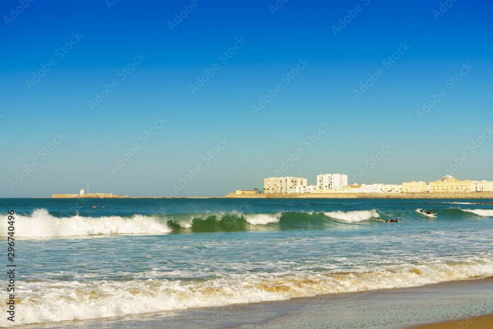 Sea waves in sunny day. Santa Maria del Mar beach in Cadiz , Andalusia, Spain